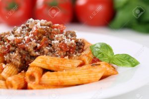Penne Rigate Bolognese or Bolognaise sauce noodles pasta meal on a plate